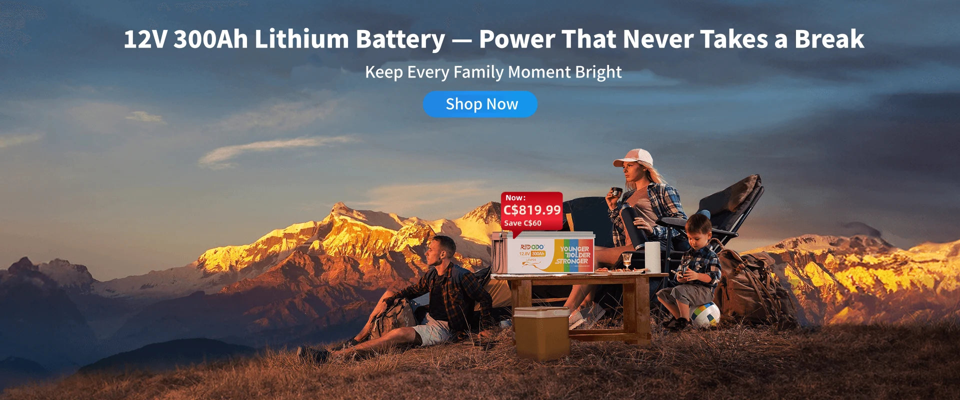 Family enjoying a picnic with a mountain view, a Redodo 12V 300Ah Lithium Battery promoting .